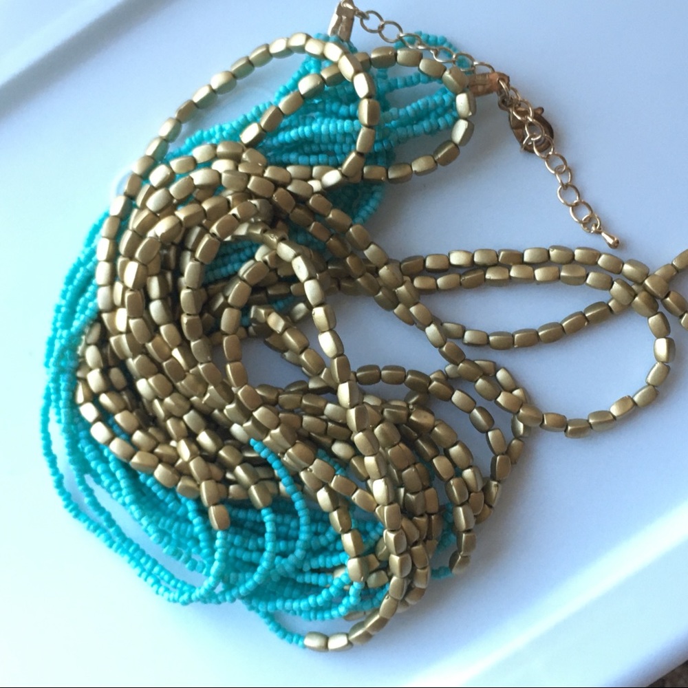 Multi-strand light blue and gold bead Necklace